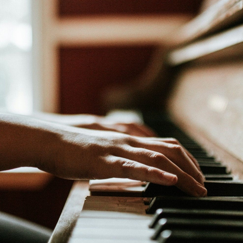 person playing piano, closeup