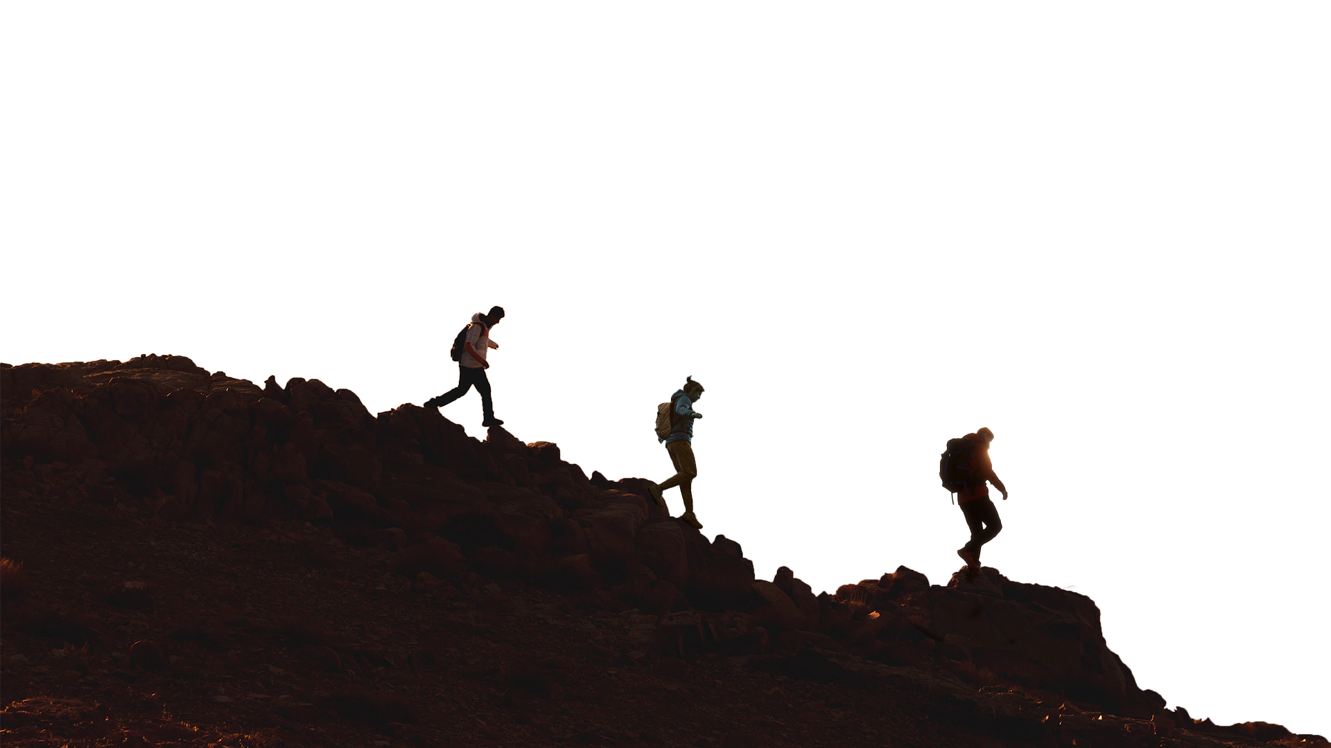 Silhoutte of people walking on mountain