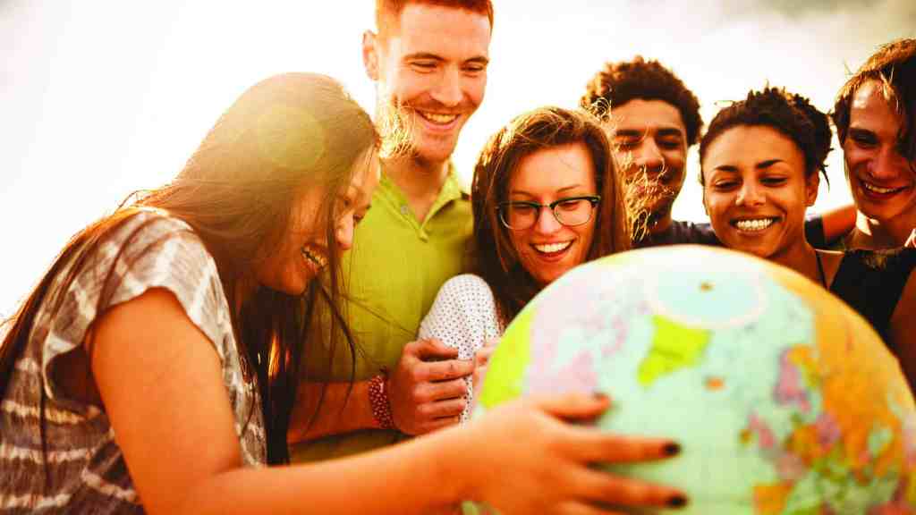 teenagers college student smiling with globe